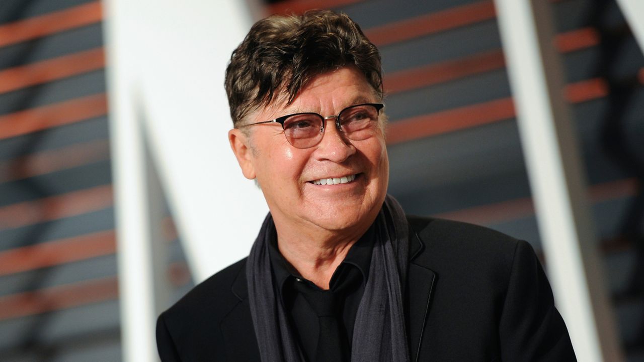 Musician Robbie Robertson arrives at the Vanity Fair Oscar Party on Sunday, Feb. 22, 2015, in Beverly Hills, Calif. (Photo by Evan Agostini/Invision/AP)