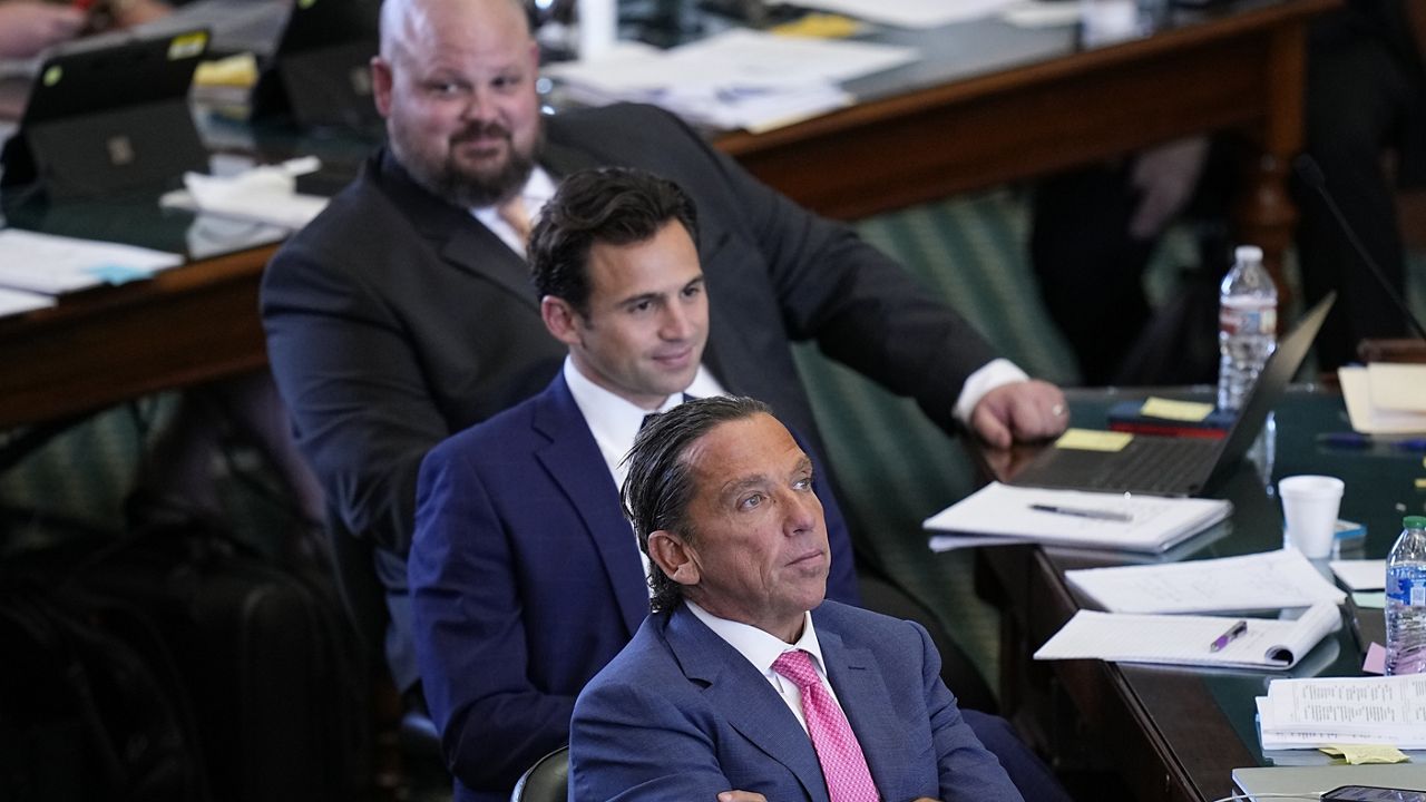 Prosecution attorney Tony Buzbee, front, and attorney Anthony Osso, center, during day three of the impeachment trial for Texas Attorney General Ken Paxton in the Senate Chamber at the Texas Capitol, Thursday, Sept. 7, 2023, in Austin, Texas. (AP Photo/Eric Gay)