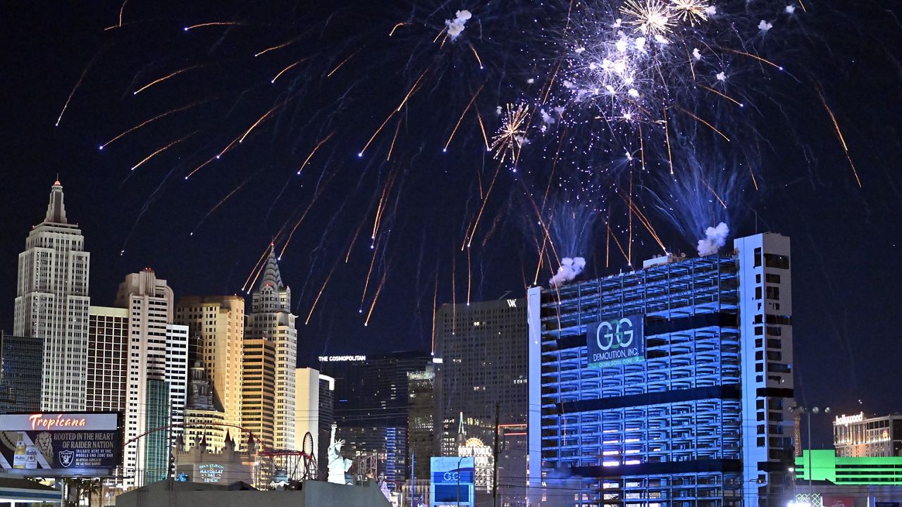 Fireworks are launched before the Tropicana Las Vegas towers are imploded, Wednesday, Oct. 9, 2024, in Las Vegas. (AP Photo/David Becker)