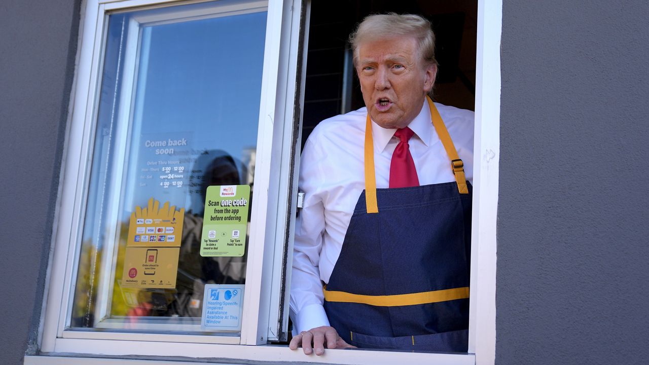 Republican presidential nominee former President Donald Trump speaks from a drive-thru window during a campaign stop at a McDonald's, Sunday, Oct. 20, 2024, in Feasterville-Trevose, Pa. (AP Photo/Evan Vucci)