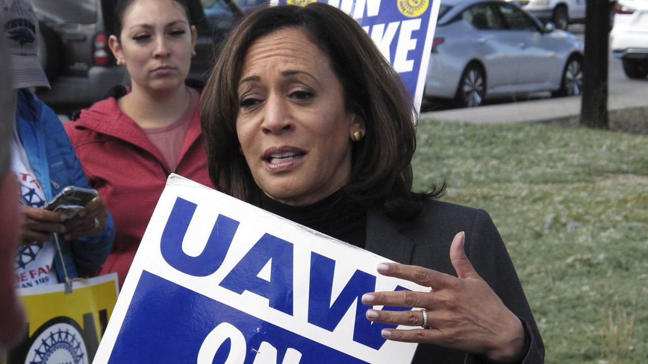 Sen. Kamala Harris, D-Calif., talks to striking workers after walking a picket line with UAW members, Thursday, Oct. 3, 2019 at a General Motors facility just north of Reno, Nev. (AP Photo/Scott Sonner)