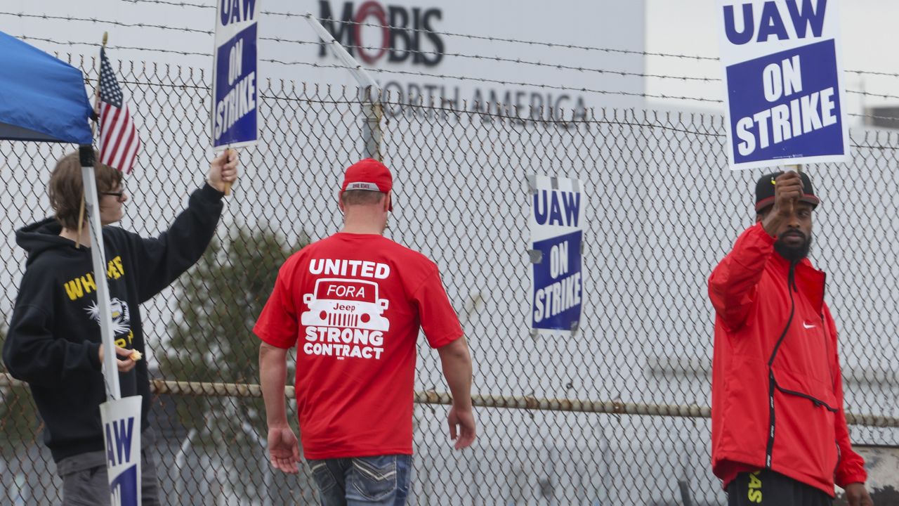 United Auto Workers union members strike for improved compensation outside of the Stellantis Toledo Assembly Complex on Thursday, Sept. 28, 2023 in Toledo, Ohio. (Phillip L. Kaplan /The Blade via AP)