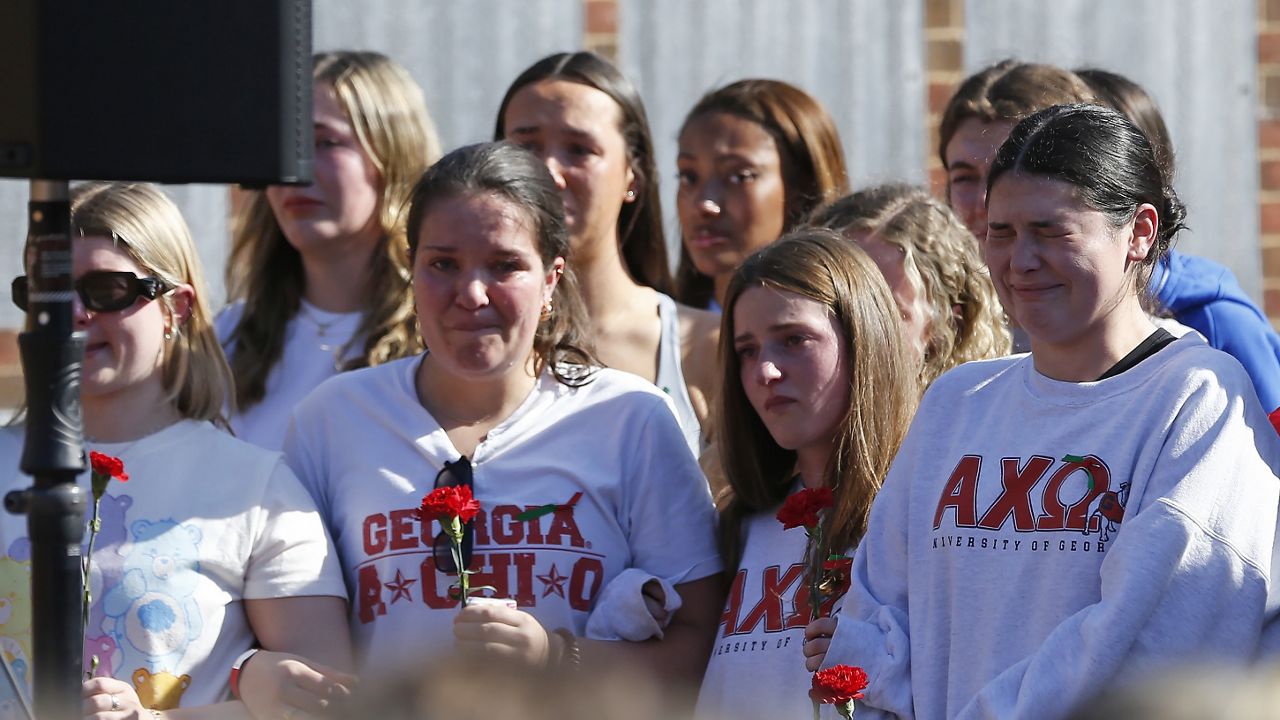 Alpha Chi Omega sorority members mourn the loss of their sorority sister, Laken Riley, during a vigil for the Augusta University College of Nursing student at the Tate Plaza on the University of Georgia campus in Athens, Ga., Monday, Feb. 26, 2024