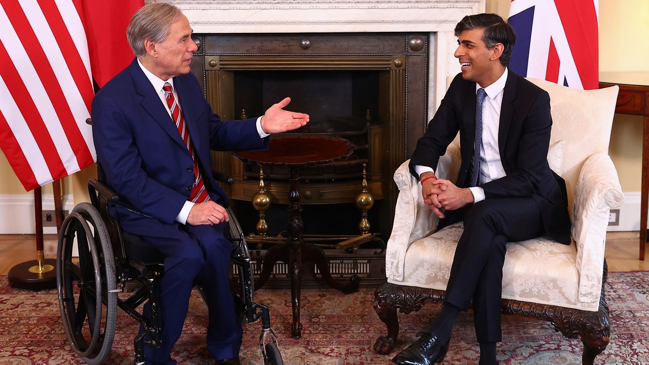 Britain's Prime Minister Rishi Sunak, right, speaks with Texas Gov. Greg Abbott at Downing Street in London, Wednesday, March 13, 2024. (Peter Nicholls/Pool via AP)