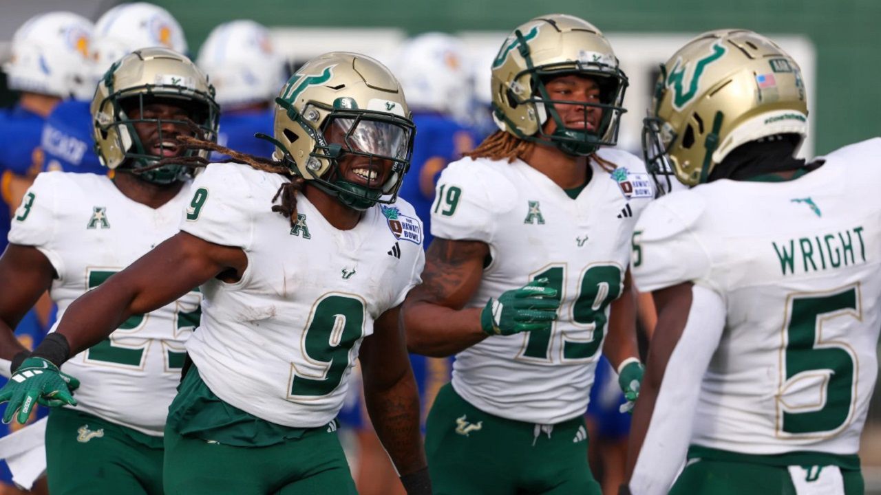 USF players celebrate a touchdown during the Bulls' 41-39 win against San Jose State in the Hawaii Bowl on Christmas Eve. USF (7-6) has won back-to-back bowl games for the first time since 2016-17. (Photo by Darryl Oumi/Getty Image) 