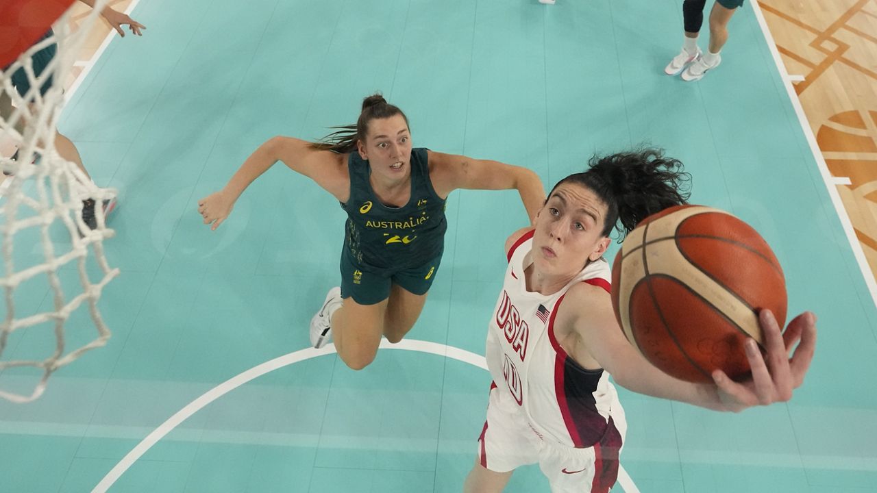 United States' Breanna Stewart (10) shoots past Isobel Borlase (20), of Australia, during a women's semifinal basketball game at Bercy Arena at the 2024 Summer Olympics, Friday, Aug. 9, 2024, in Paris, France. (AP Photo/Michael Conroy, Pool)