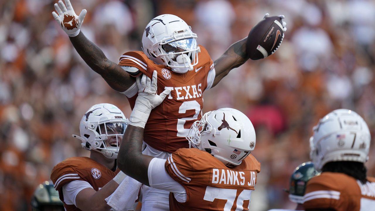 Texas wide receiver Matthew Golden (2) celebrates with teammates after scoring a touchdown against Colorado State during the first half of an NCAA college football game in Austin, Texas, Saturday, Aug. 31, 2024. (AP Photo/Eric Gay)