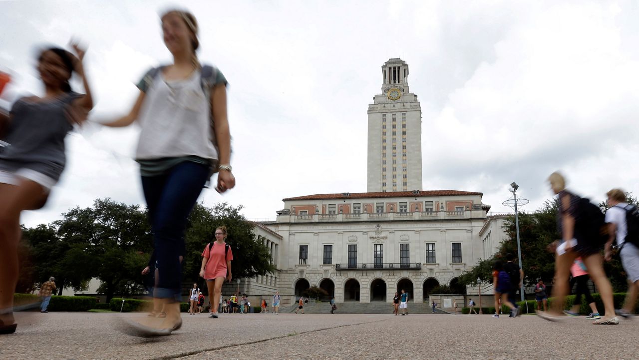 In this Sept. 27, 2012, file photo, students walk through the University of Texas at Austin campus near the school's iconic tower in Austin, Texas. A ban on diversity, equity and inclusion initiatives in higher education has led to more than 100 job cuts across university campuses in Texas, a hit echoed or anticipated in numerous other states where lawmakers are rolling out similar policies during an important election year. (AP Photo/Eric Gay, File)