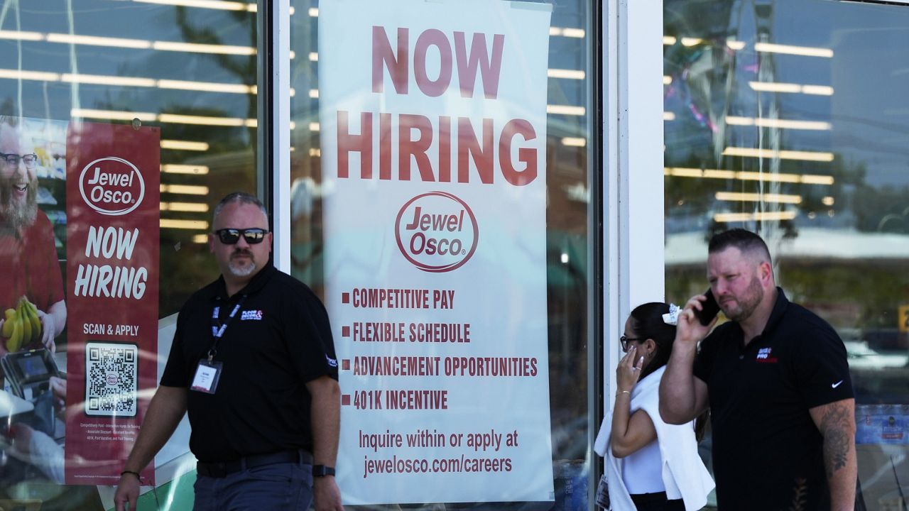 A hiring sign is displayed at a grocery store in Deerfield, Ill., Thursday, July 25, 2024. (AP Photo/Nam Y. Huh)