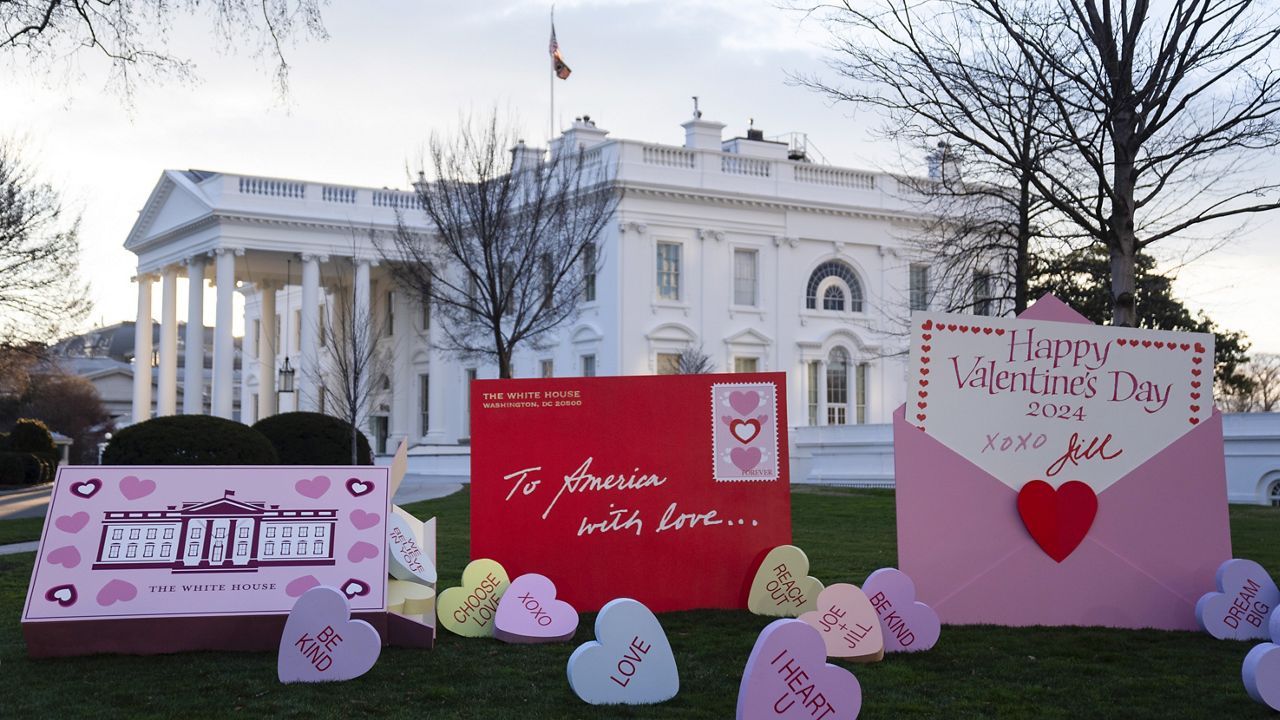 Decorations for Valentine's Day adorn the White House lawn, Wednesday, Feb. 14, 2024, in Washington. (AP Photo/Evan Vucci)