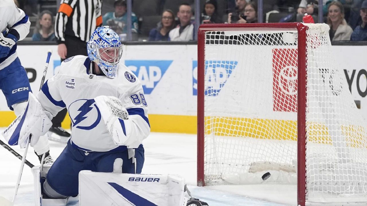 Tampa Bay Lightning goaltender Andrei Vasilevskiy (88) looks back as the puck goes into the net for a goal by San Jose Sharks center Tyler Toffoli during the first period of an NHL hockey game in San Jose, Calif., Thursday, Jan. 2, 2025. (AP Photo/Tony Avelar)