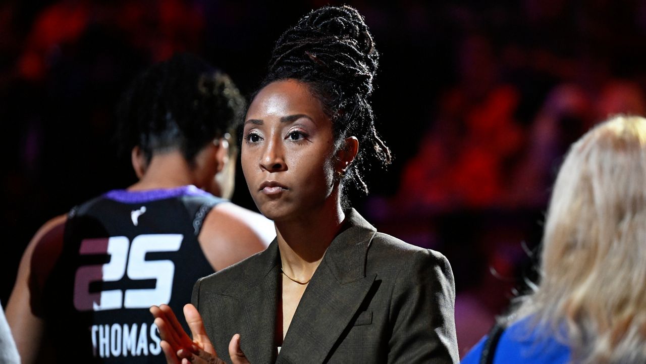 Connecticut Sun assistant coach Briann January at the start of a WNBA basketball semifinal game against the Minnesota Lynx, Oct. 4, 2024, in Uncasville, Conn. (AP Photo/Jessica Hill, File)