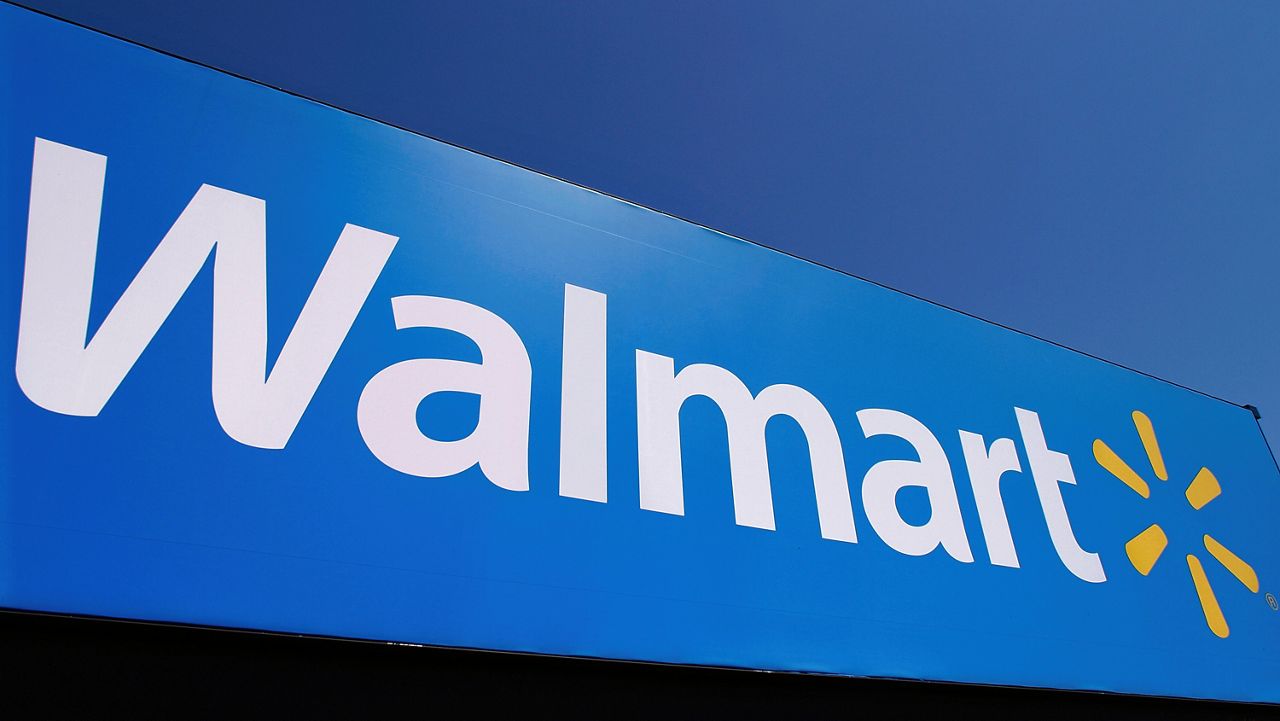 The Walmart logo is displayed on a store in Springfield, Ill. The newley remodeled Walmart Supercenter in south St. Louis County is celebrating its grand re-opening with an event opened to the community. (AP Photo/Seth Perlman, File)