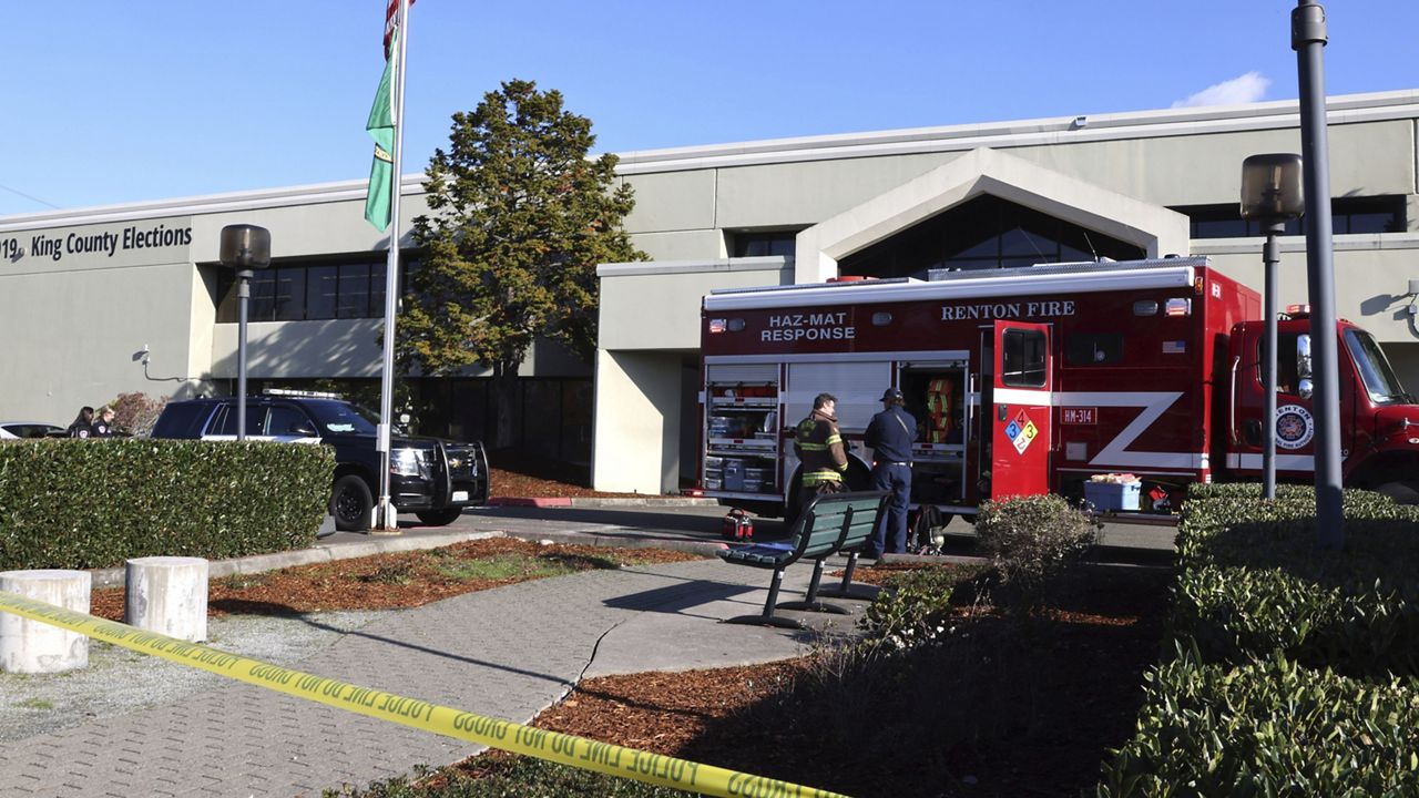 Emergency and law enforcement agencies respond to a possible hazmat situation at the King County Elections office in Renton, Wash., Wednesday, Nov. 8, 2023. (Karen Ducey/The Seattle Times via AP)