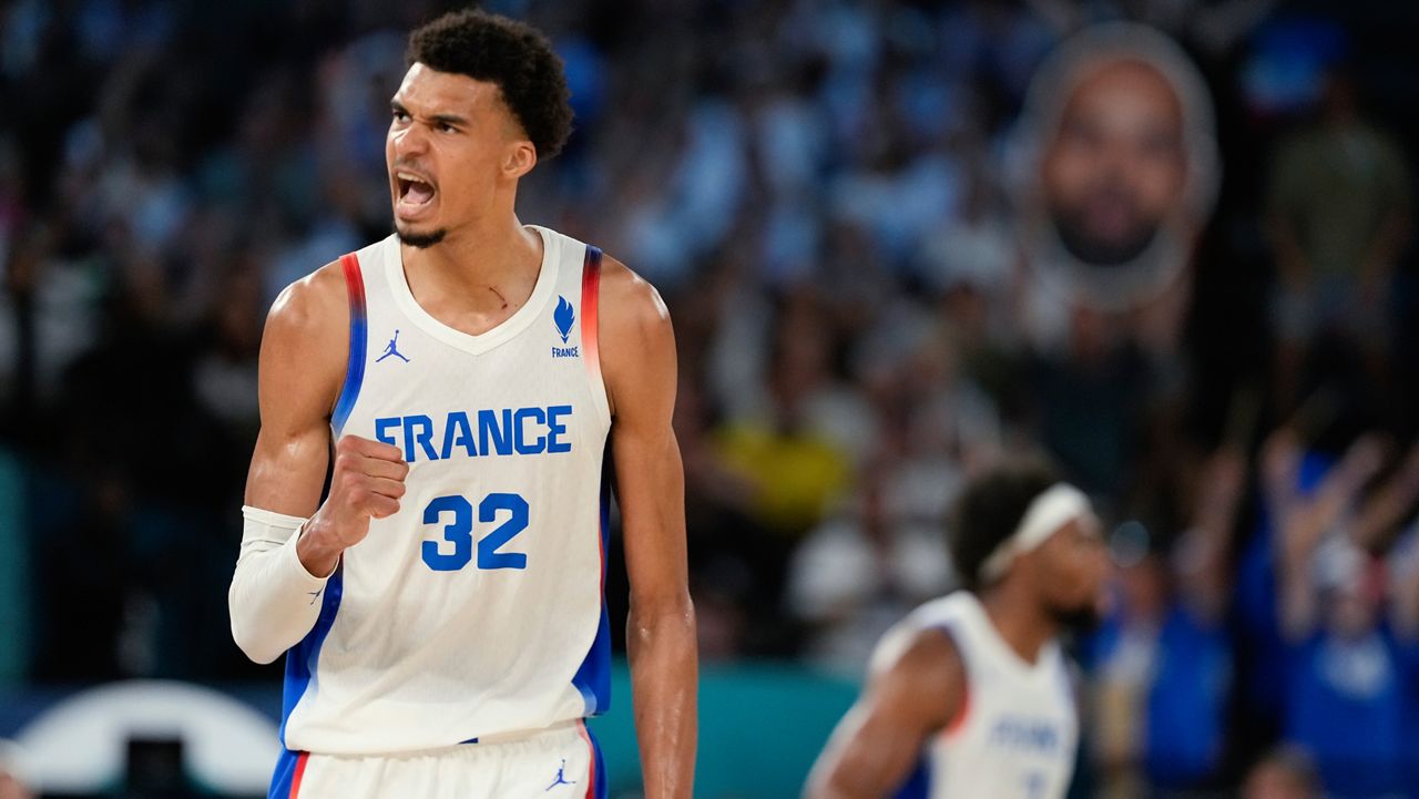 Victor Wembanyama (32), of France celebrates after scoring a basket against United States during a men's gold medal basketball game at Bercy Arena at the 2024 Summer Olympics, Saturday, Aug. 10, 2024, in Paris, France. (AP Photo/Mark J. Terrill)