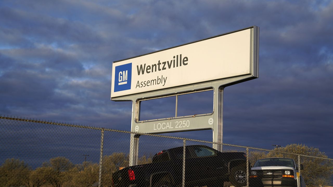 A sign stands near an entrance to a General Motors assembly plant Wednesday, March 24, 2021, in Wentzville, Mo. (AP Photo/Jeff Roberson)