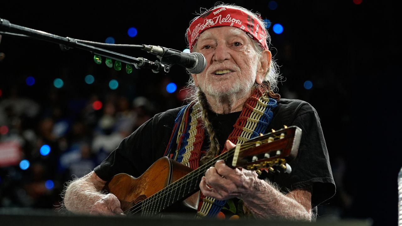 Willie Nelson performing ahead of event for Democratic presidential nominee Vice President Kamala Harris at a rally in Houston, Friday, Oct. 25, 2024. (AP Photo/Susan Walsh)