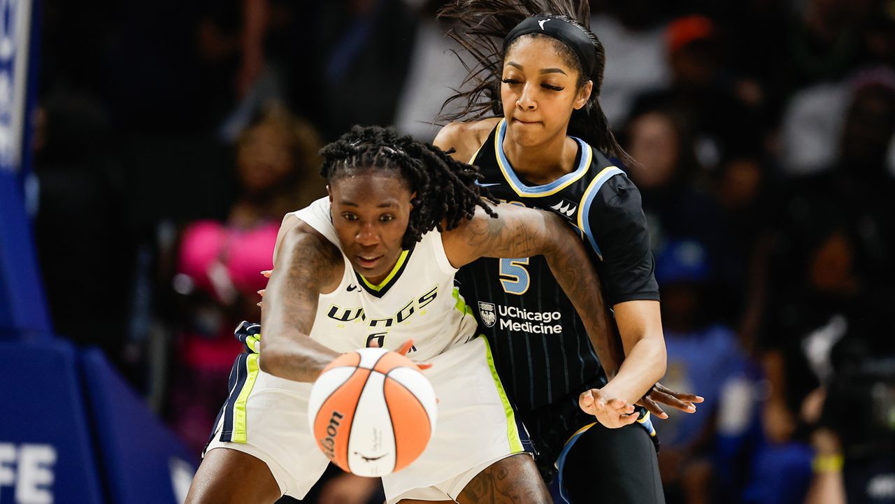 Chicago Sky forward Angel Reese (5) defends against Dallas Wings forward Natasha Howard (6) during a WNBA basketball game, Wednesday, May 15, 2024, in Arlington, Texas. Dallas won 87-79. (AP Photo/Brandon Wade)