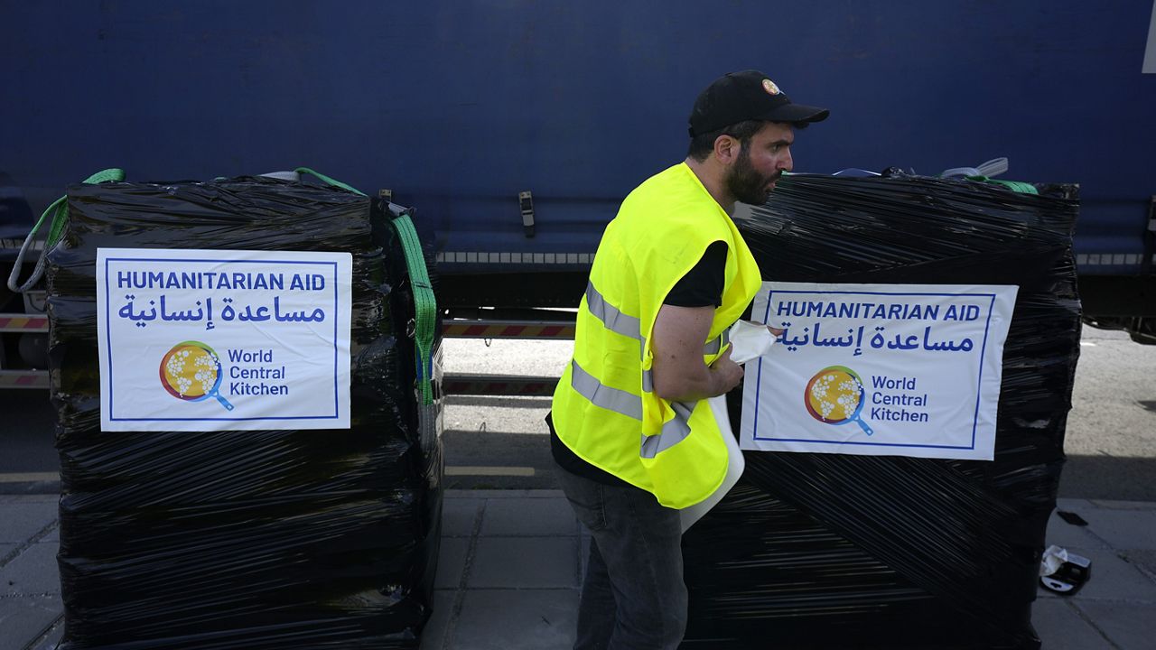 A member of the World Central Kitchen prepares a pallet with the humanitarian aid for transport to the port of Larnaca from where it will be shipped to Gaza, at a warehouse near Larnaca, Cyprus, on March 13, 2024. (AP Photo/Petros Karadjias)