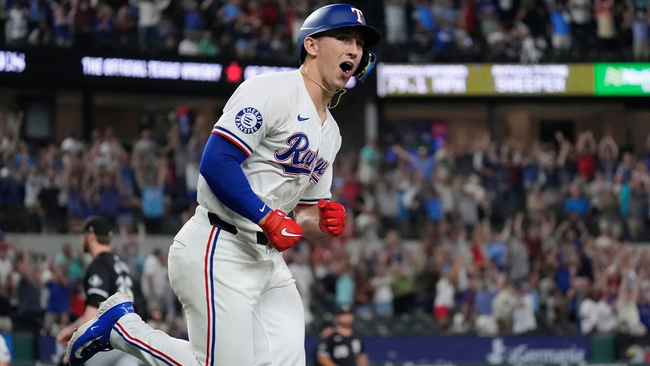 Texas Rangers' Wyatt Langford yells after hitting a single which scored teammate Travis Jankowski during the 10th nning of a baseball game against the Chicago White Sox in Arlington, Texas, Monday, July 22, 2024. (AP Photo/LM Otero)