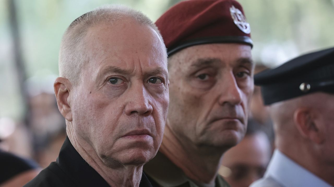 Israel's Defense Minister Yoav Gallant, left, and Chief of the General Staff Lieutenant-General Herzi Halevi, attend a ceremony marking the Hebrew calendar anniversary of the Hamas attack on October 7 last year that sparked the ongoing war in Gaza, at the Mount Herzl military cemetery in Jerusalem, Israel Sunday Oct. 27, 2024. (Gil Cohen-Magen/Pool Photo via AP)