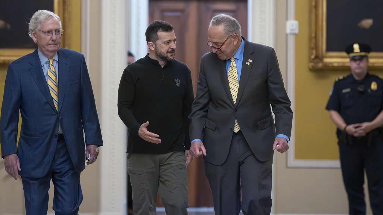 Ukrainian President Volodymyr Zelenskyy, center, walks with Senate Minority Leader Mitch McConnell, R-Ky., left, and Senate Majority Leader Chuck Schumer, D-N.Y., as he arrives for a briefing with lawmakers about the war effort against Russia, at the Capitol in Washington, Thursday, Sept. 26, 2024. (AP Photo/J. Scott Applewhite)