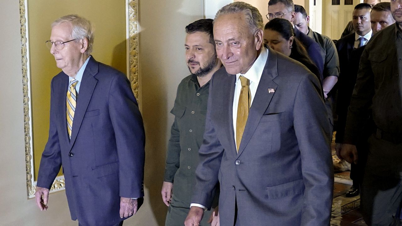 Ukrainian President Volodymyr Zelenskyy, center, walks with Senate Minority Leader Mitch McConnell of Ky., left, and Senate Majority Leader Chuck Schumer of N.Y., right, after meeting with members of Congress, Thursday, Sept. 21, 2023, at the Capitol in Washington. (AP Photo/Mariam Zuhaib)