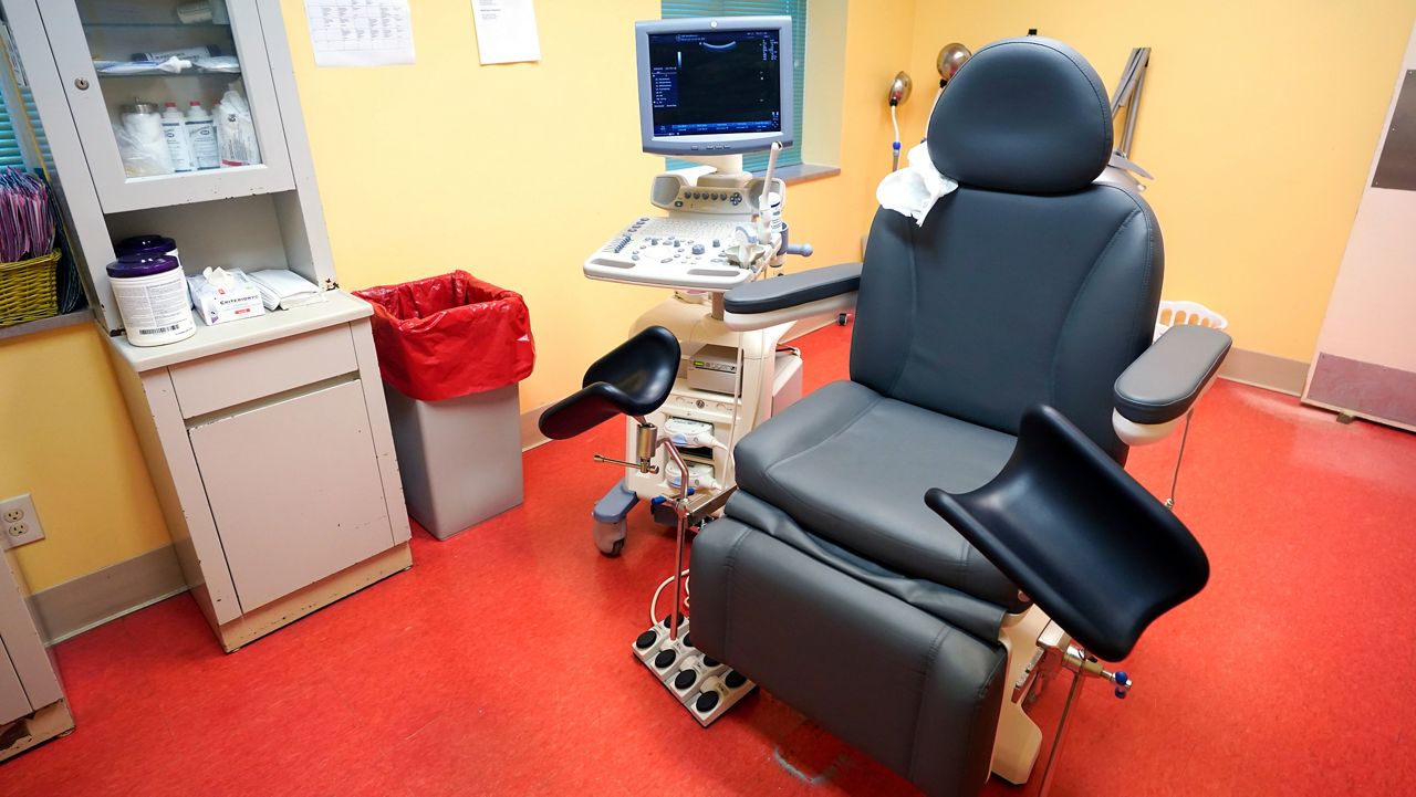A stirrups exam chair rests in the center of one of the exam rooms of the Jackson Women's Health Organization. (AP Photo/Rogelio V. Solis)