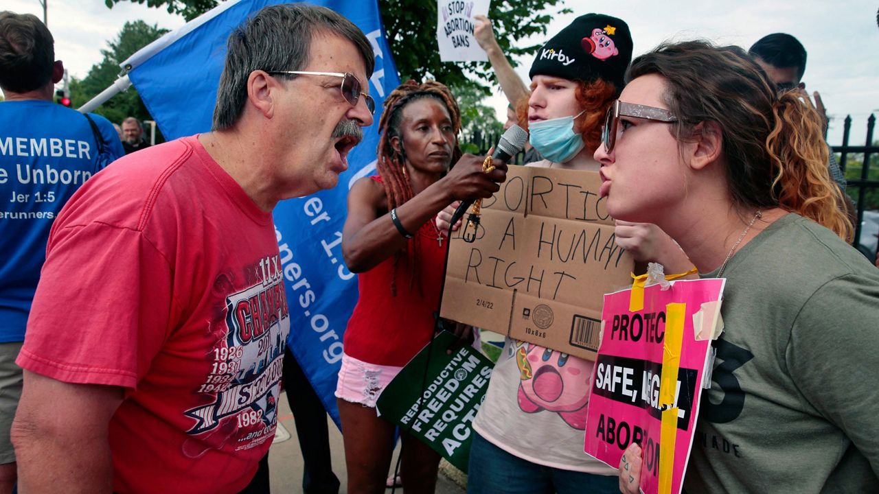 Steve Sallwasser, of Arnold, debates Brittany Nickens, of Maplewood, during competing rallies outside Planned Parenthood of Missouri, following the U.S. Supreme Court decision to overturn Roe v. Wade, June 24, 2022, in St. Louis. (Robert Cohen/St. Louis Post-Dispatch via AP, File)