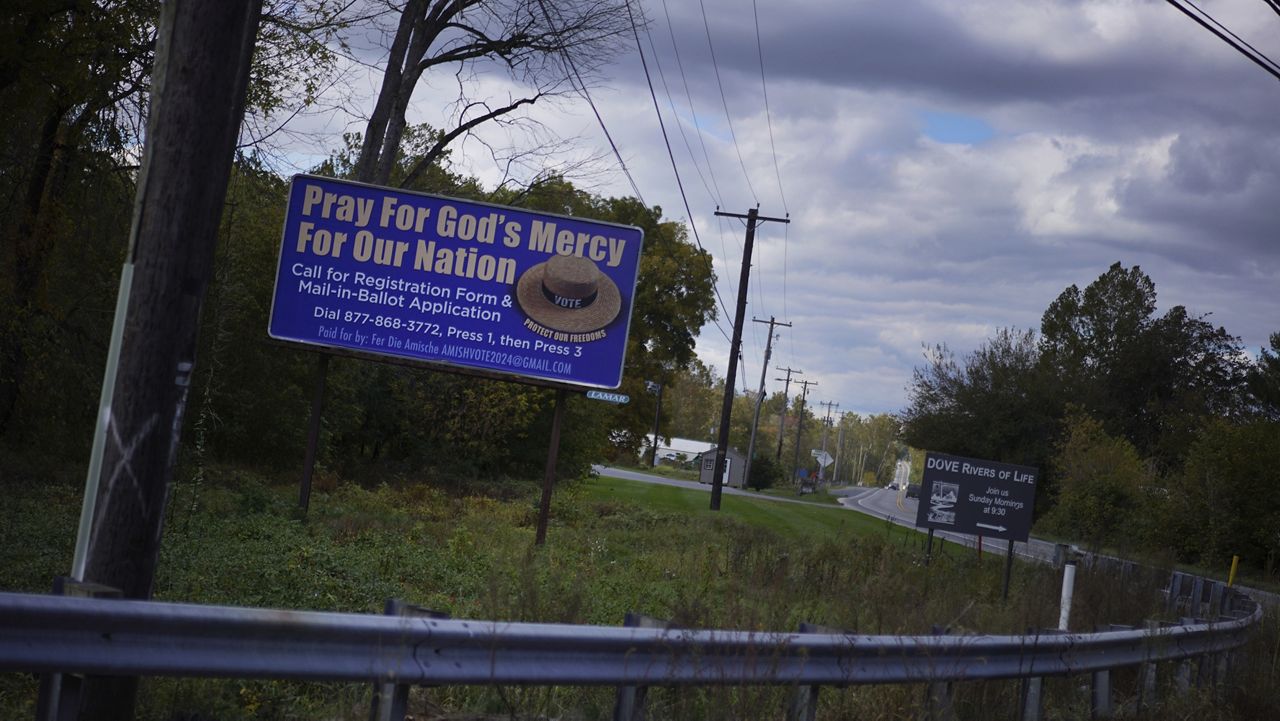 A voting advertisement geared toward the Amish population of Lancaster County is seen from the road in Strasburg, Pa., on Tuesday, Oct. 15, 2024. (AP Photo/Jessie Wardarski)