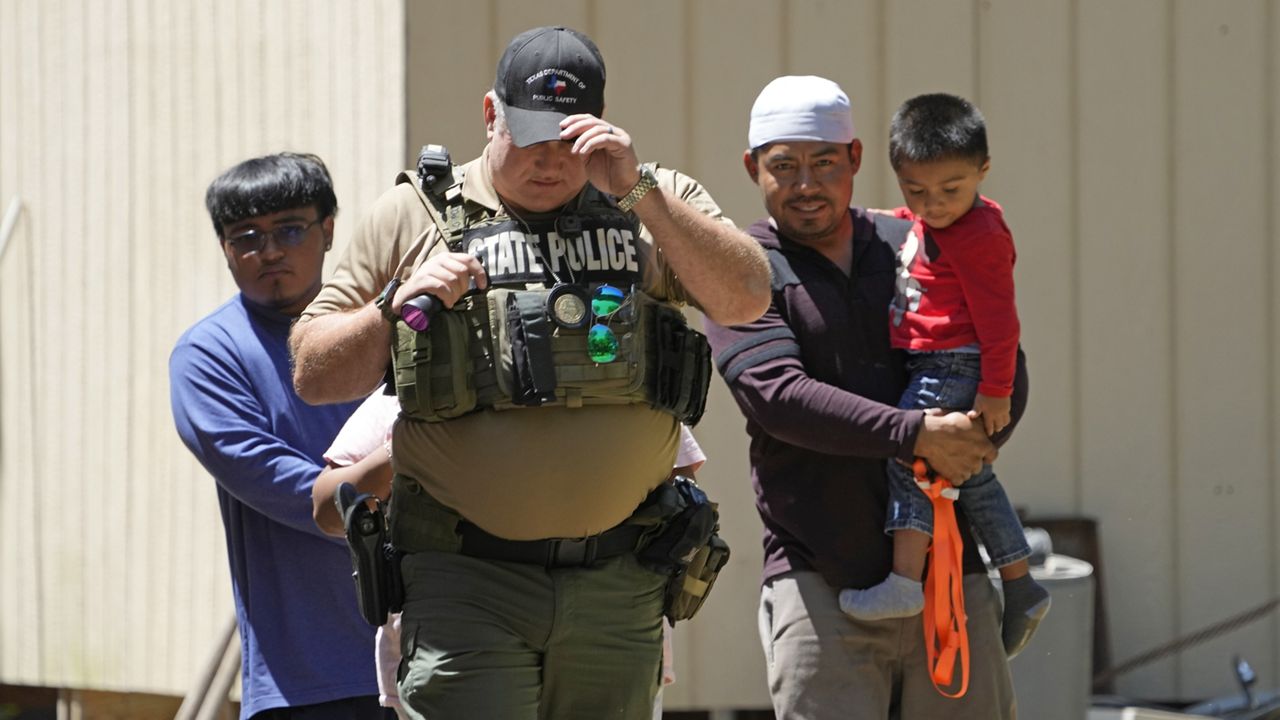 A law enforcement official works Sunday, April 30, 2023, in the neighborhood where a mass shooting occurred Friday night, in Cleveland, Texas. The search for a man who allegedly shot his neighbors after they asked him to stop firing off rounds in his yard stretched into a second day Sunday, with authorities saying the man could be anywhere by now. Francisco Oropeza, 38, fled after the shooting Friday night that left several people dead, including an 8-year-old boy. (AP Photo/David J. Phillip)