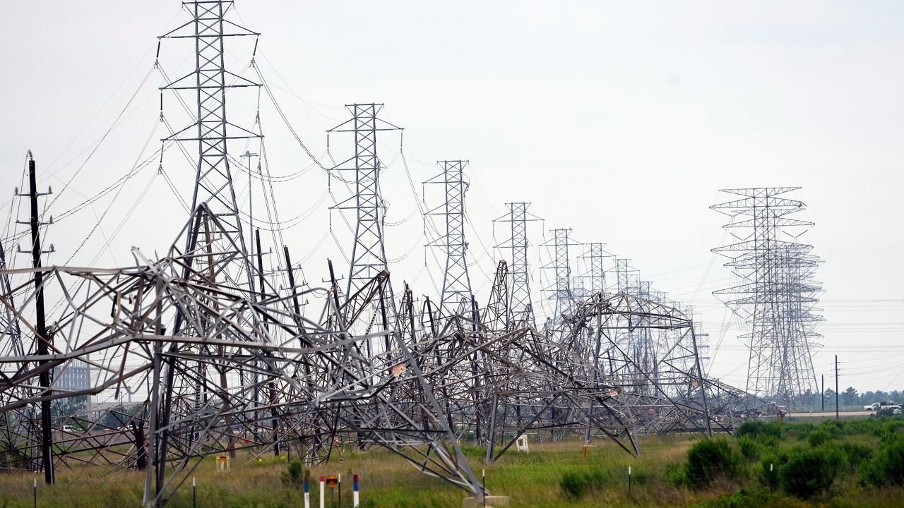 Down power lines are shown in the aftermath of a severe thunderstorm Friday, May 17, 2024, in Cypress, Texas, near Houston. Thunderstorms pummeled southeastern Texas on Thursday killing at least four people, blowing out windows in high-rise buildings and knocking out power to more than 900,000 homes and businesses in the Houston area. (AP Photo/David J. Phillip)