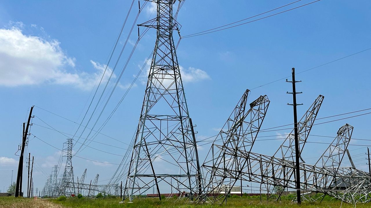 Power transmission lines were twisted and toppled after powerful storms swept through the Houston area on Saturday, May 18, 2024 in Cypress, Texas. (AP photo/Mark Vancleave)