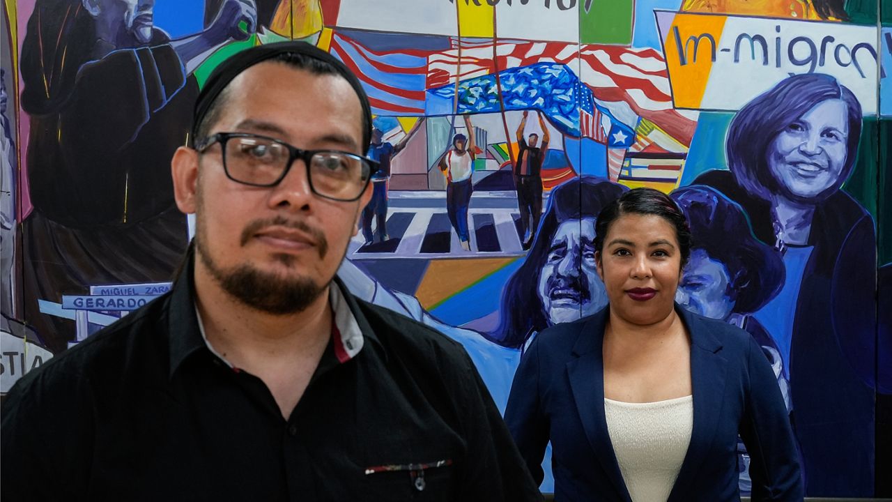 Antonio Valle, left, and wife, Brenda, stand for a photo after an interview with The Associated Press in Los Angeles, Tuesday, June 18, 2024. Both were born in Mexico. Antonio Valle has been a U.S. citizen since 2001. Brenda Valle came to the U.S. with her family when she was 3 years old and will now be eligible for legal status under Biden's new plan. She is a DACA recipient and has worried every two years whether it would get renewed. Their sons are U.S. citizens. (AP Photo/Jae C. Hong)
