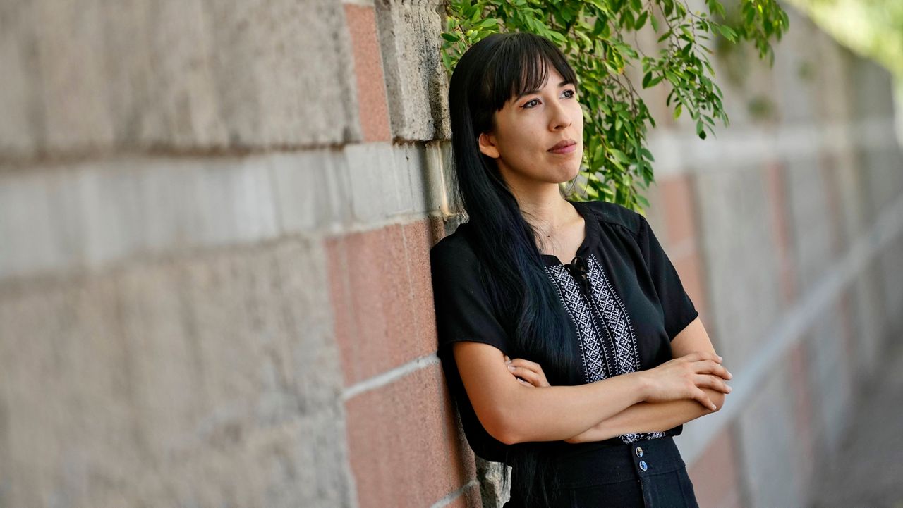 Jocelyn Ruiz, 26, pictured in Tempe, Ariz., Tuesday, Oct. 22, 2024, is a U.S. citizen who discovered a family secret that her mother could be deported at any time. (AP Photo/Matt York)