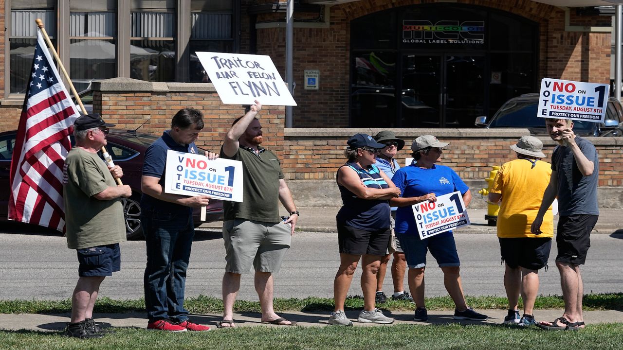 A small group of protestors gather during a "rosary rally" on Aug. 6, 2023, in Norwood, Ohio. Turnout is robust and misinformation rampant as Ohio concludes a hastily called and highly charged special election Tuesday, a contest that could determine the fate of abortion rights in the state and fuel political playbooks nationally heading into 2024. (AP Photo/Darron Cummings, File)