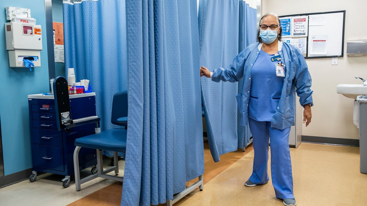 A nurse works in the laboratory room in El Nuevo San Juan Health Center at the Bronx borough in New York,  Jan. 11, 2024. (AP Photo/Eduardo Munoz Alvarez, File)