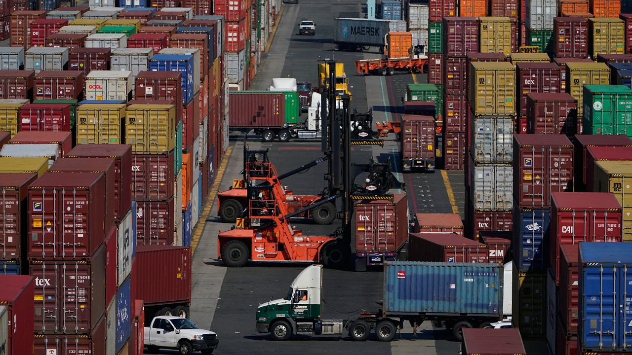 Containers are moved at the Port of New York and New Jersey in Elizabeth, N.J., on June 30, 2021. (AP Photo/Seth Wenig, File)