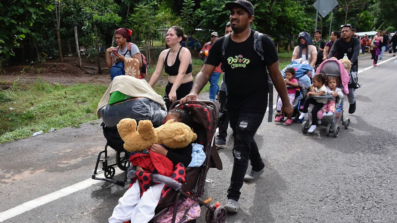 Migrants walk through Tapachula, Chiapas state, Mexico, Wednesday, Nov. 20, 2024, hoping to reach the U.S. border. (AP Photo/Edgar H. Clemente)