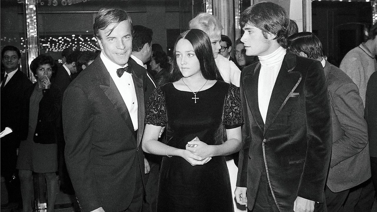 "Romeo and Juliette" movie director Franco Zeffirelli, left, actors Olivia Hussey, center, and Leonard Whiting are seen after the Parisian premiere of the film in Paris on Sept. 25, 1968. (AP Photo/Eustache Cardenas, File)