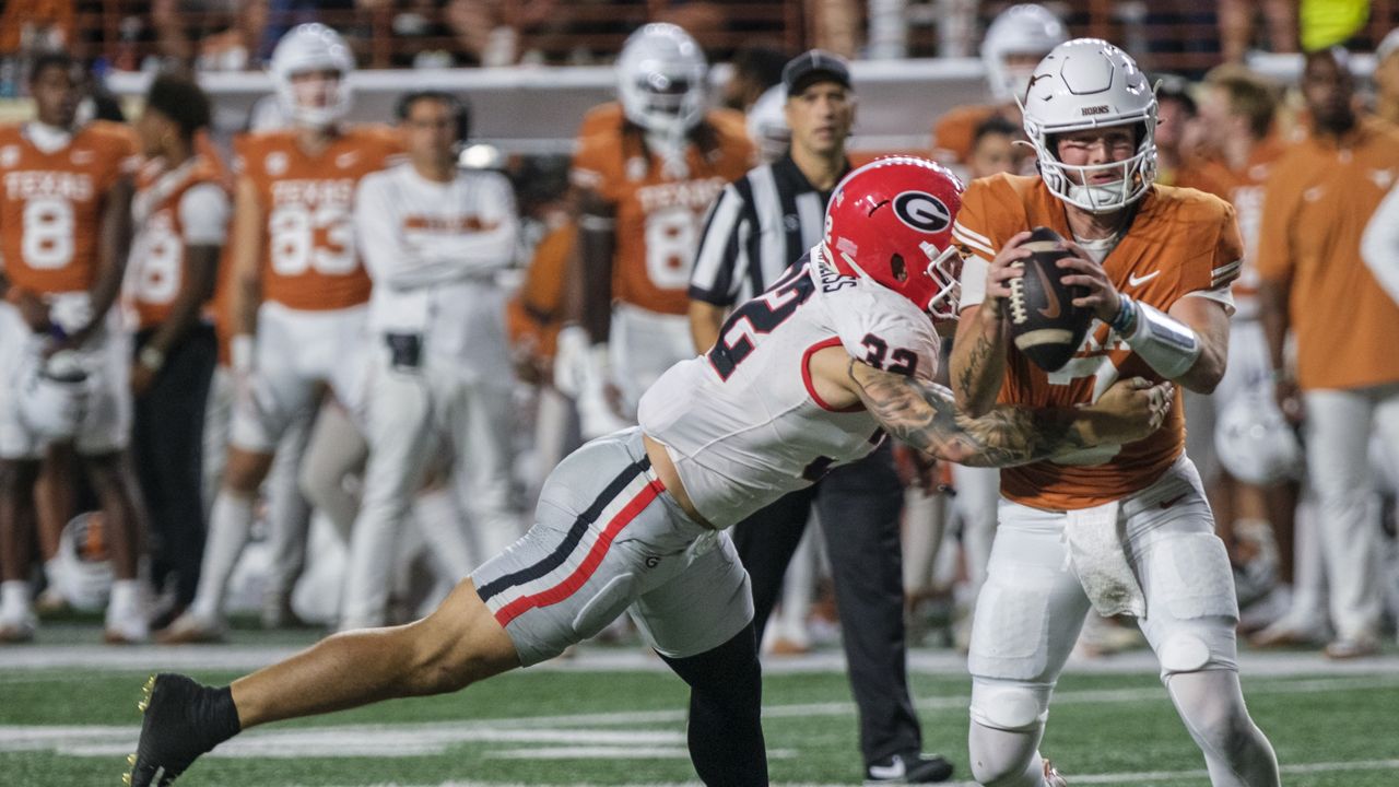 Texas quarterback Quinn Ewers (3) is sacked for a loss by Georgia linebacker Chaz Chambliss (32) during the second half of an NCAA college football game in Austin, Texas, Saturday, Oct. 19, 2024. (AP Photo/Rodolfo Gonzalez)