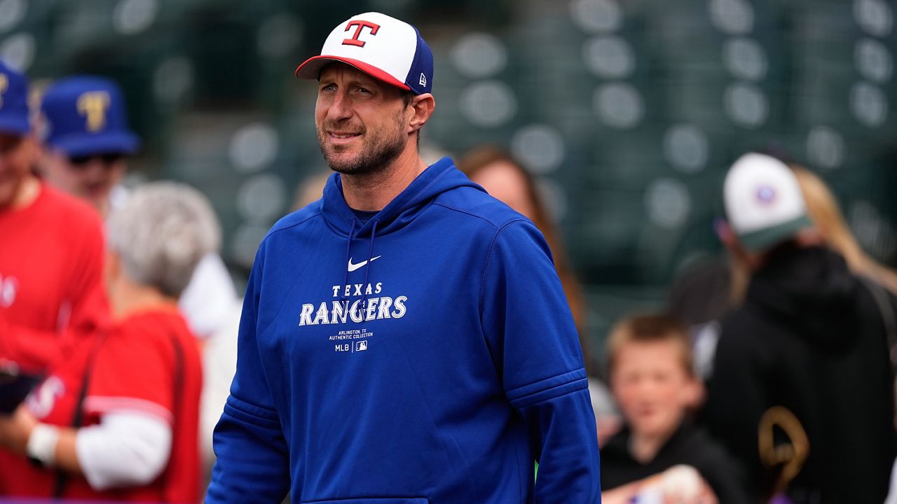 Texas Rangers pitcher Max Scherzer warms up before a baseball game against the Colorado Rockies, Friday, May 10, 2024, in Denver. (AP Photo/David Zalubowski)