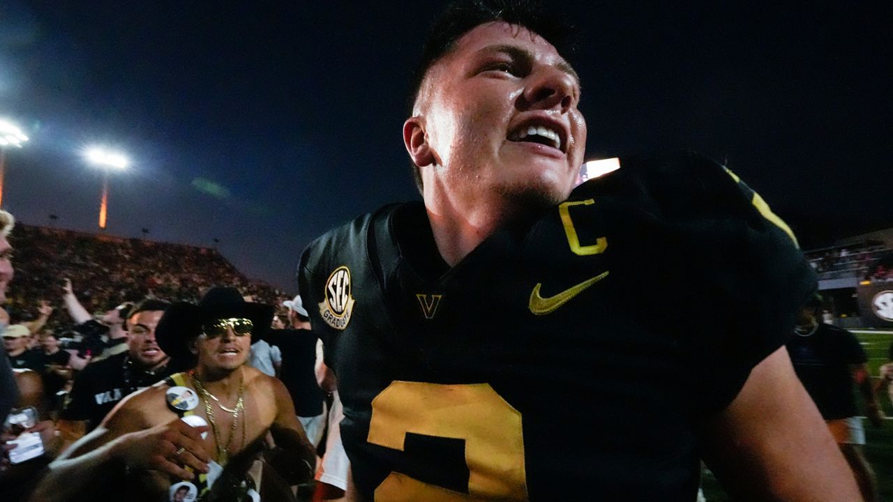 Vanderbilt quarterback Diego Pavia (2) celebrates the team's 40-35 win against Alabama after an NCAA college football game Saturday, Oct. 5, 2024, in Nashville, Tenn. (AP Photo/George Walker IV)