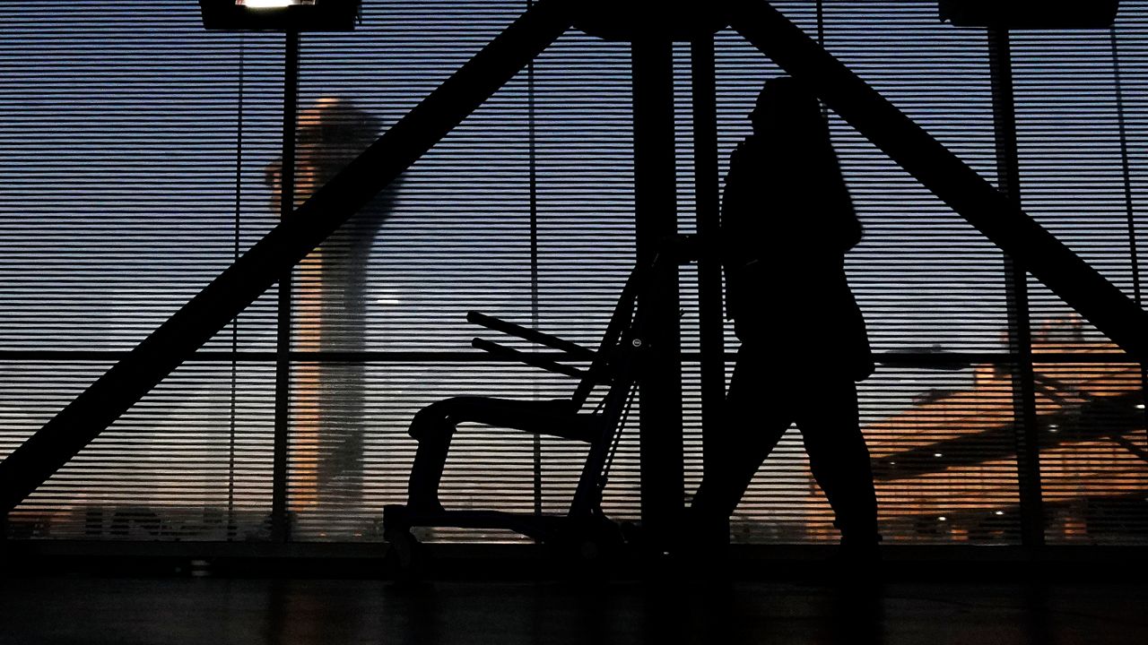 An airline employee transfers a wheelchair to her station at O'Hare International Airport in Chicago, Nov. 23, 2022. (AP Photo/Nam Y. Huh, File)