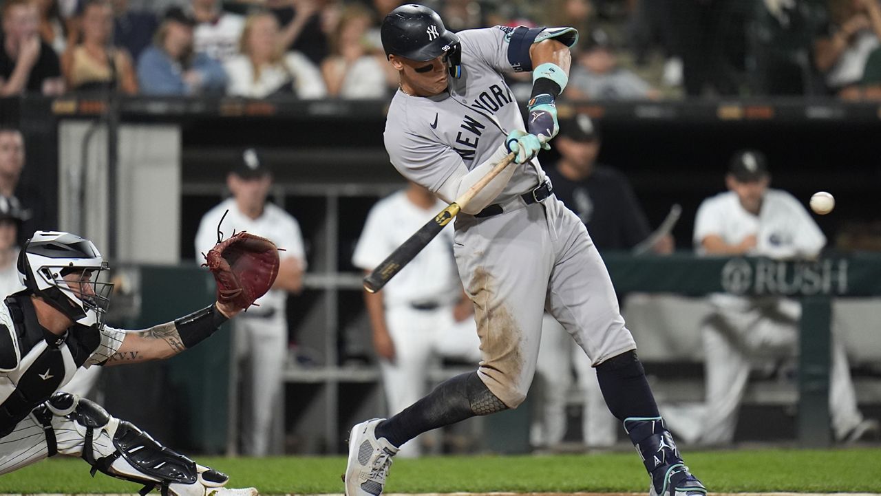 New York Yankees designated hitter Aaron Judge hits his 300th career home run, the fastest playing in MLB history to do so, during the eighth inning of a baseball game against the Chicago White Sox, Wednesday, Aug. 14, 2024, in Chicago. (AP Photo/Erin Hooley)