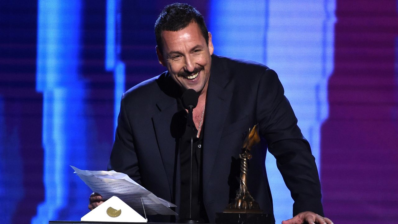 Adam Sandler accepts the award for best male lead for "Uncut Gems" at the 35th Film Independent Spirit Awards on Feb. 8, 2020, in Santa Monica, Calif. (AP Photo/Chris Pizzello, File)