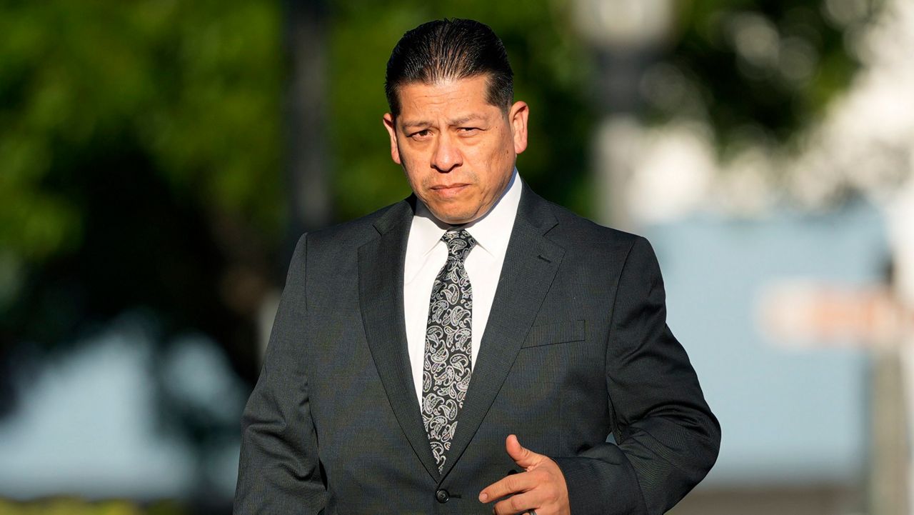 Former Uvalde Consolidated Independent School District police officer Adrian Gonzales arrives at the Uvalde County Courthouse, Thursday, July 25, 2024, in Uvalde, Texas. Gonzales made his first court appearance on charges of abandoning and failing to protect children. (AP Photo/Eric Gay)