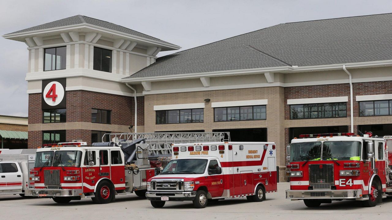 a fire station No. 4 with three emergency vehicles parked outside