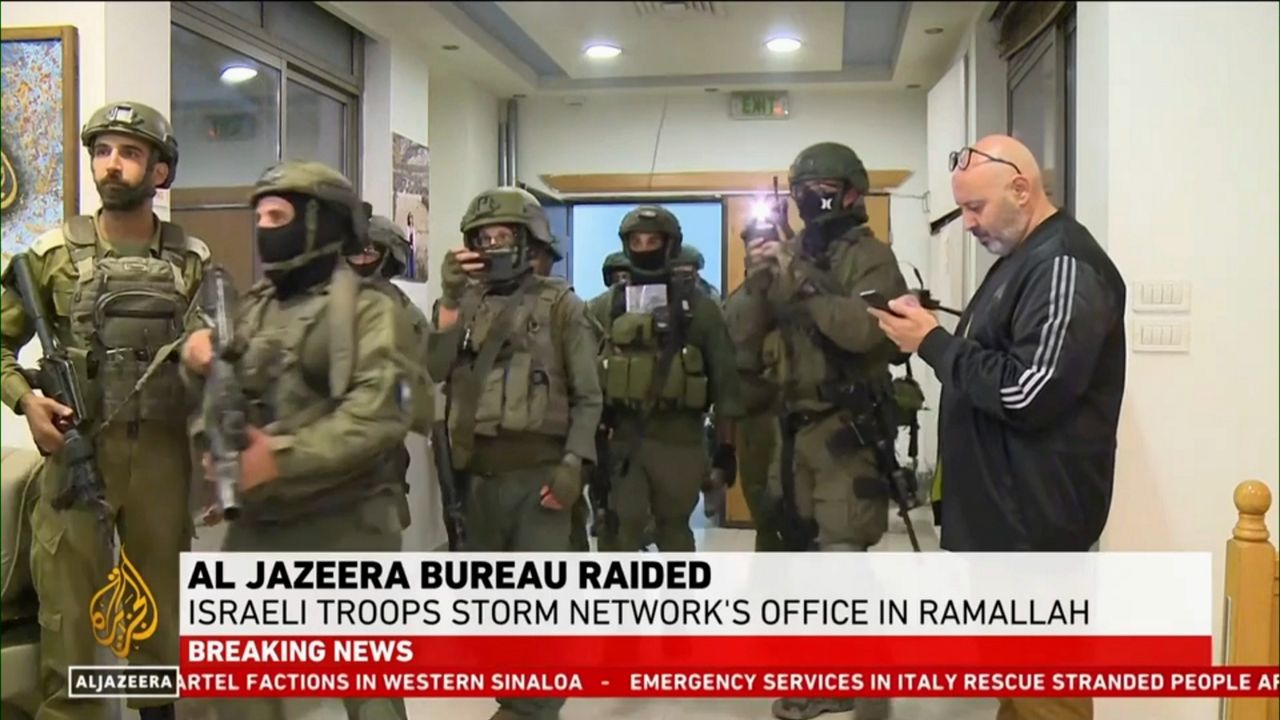 This image made from video provided by Al Jazeera English shows Israeli troops raiding their bureau in Ramallah, West Bank, Sunday, Sept. 22, 2024. (Al Jazeera via AP)