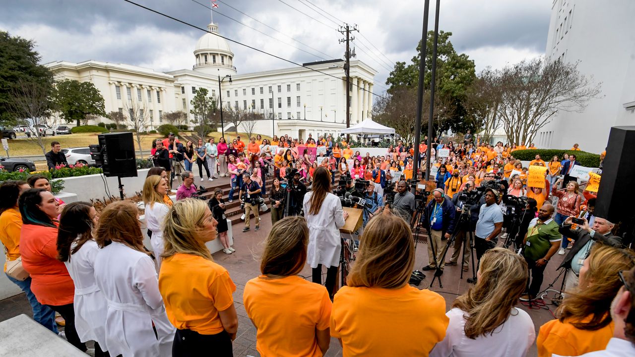Hundreds gather for a protest rally for in vitro fertilization legislation Wednesday, Feb. 28, 2024, in Montgomery, Ala. The Alabama Supreme Court ruled, Friday, Feb. 16, 2024, that frozen embryos can be considered children under state law, a ruling critics said could have sweeping implications for fertility treatments. (Mickey Welsh/The Montgomery Advertiser via AP)